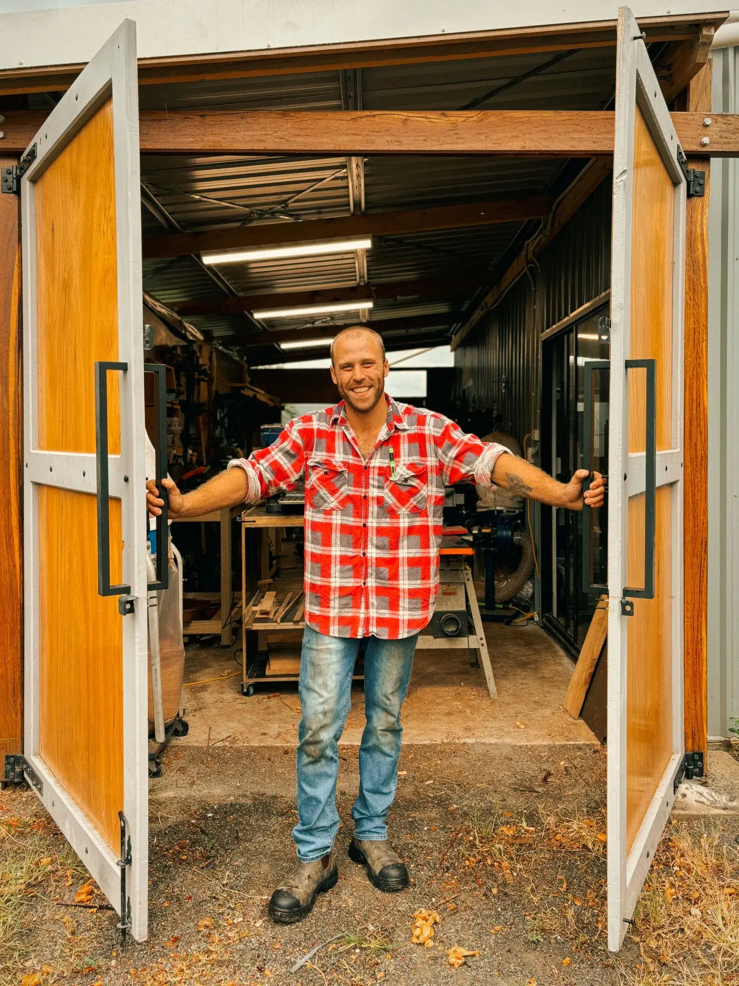 The maker behind Grizzly Timber Works standing in the workshop